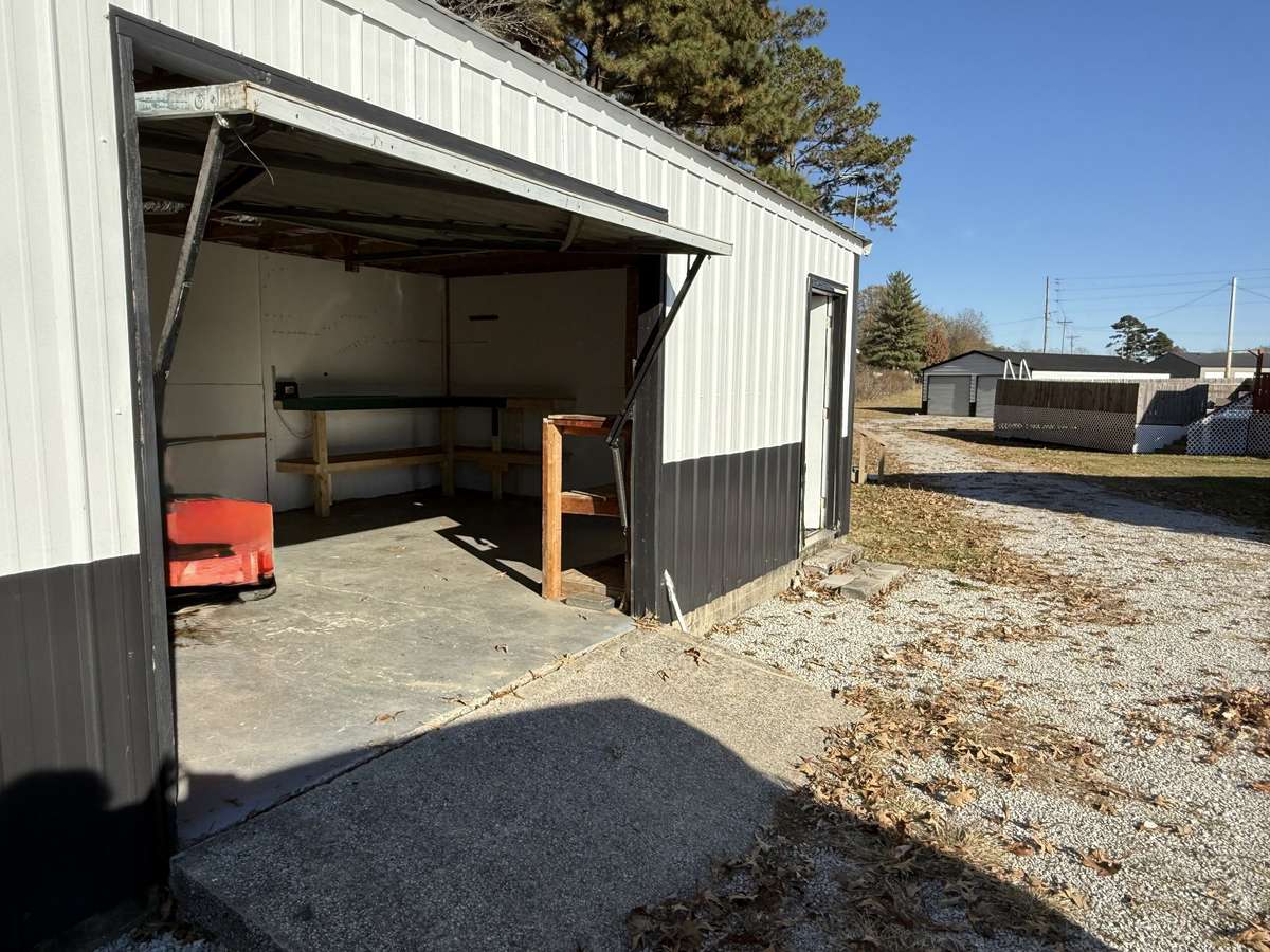 Measures 16’ x 24’ with built in shelving/worktops. Offers lights/outlets.