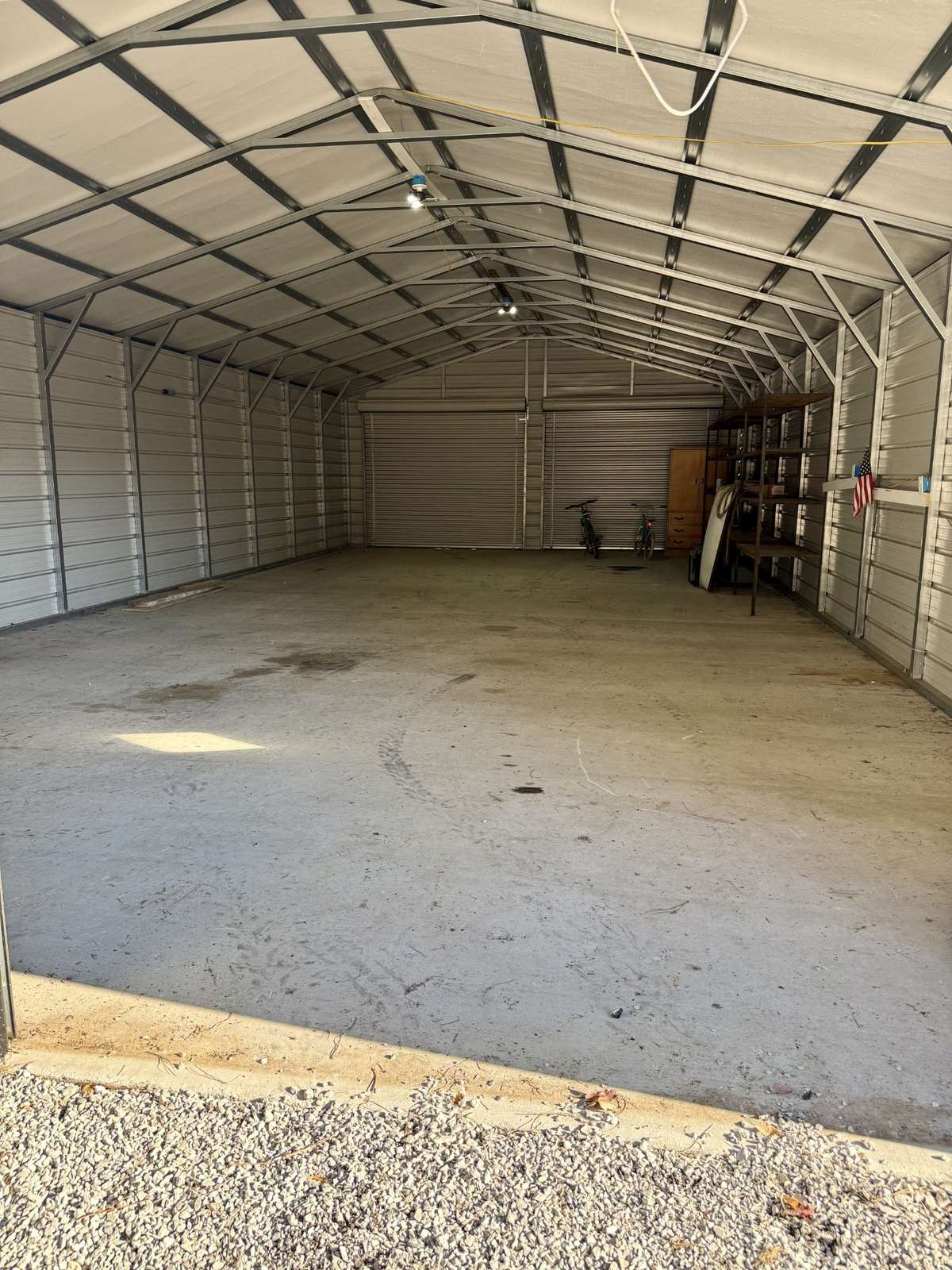 Drive thru shop with lights and concrete flooring measures 24’x50’. Features 4 Bay doors to easily pull through with trailers. Total Square Feet is 1207. Your just minutes away from Tims Ford Dam being approximately 7 miles away.