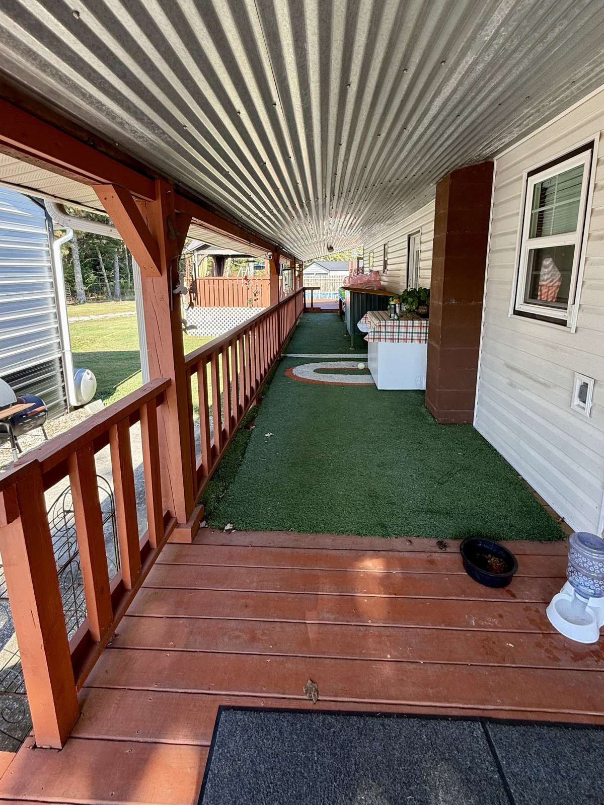 Covered Back Porch leading to pool. Approx. 7.8'x48.5'