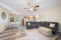 The home has no carpet and LVP flooring throughout. The living room is spacious enough for a  small sectional or a couch + loveseat setup.