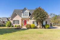 Welcome home!  Inviting front porch, great curb appeal, and side entry garage!