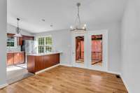 Dinning Area with Hardwood Floors and Outside Deck