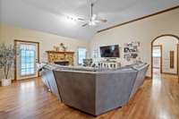 Hardwood floors (added approximately 3 years ago) and a rock fireplace add a cozy charm to this room.  The home was freshly painted then as well