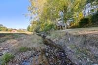 The creek is on the back of the property