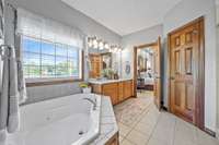 A separate tub and shower exists in the Primary bedroom