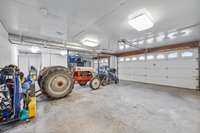 The 3 car garage has room for more than vehicles