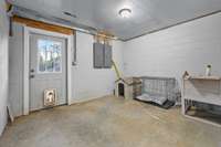 This room belongs to the seller's pet. It is set up perfectly and allows for access to the back fenced in area through the doggie door