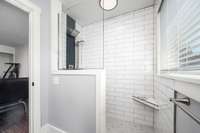 Secondary bathroom features a large walk in shower