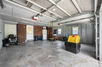 Large two car garage with additional attic storage