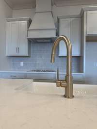 Pictures are of another completed Bay 1A floor plan. Final finishes will vary.