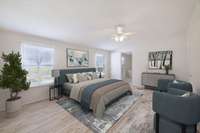 Primary Bedroom with a view into ensuite bath (virtually staged).The primary bedroom is on the opposite end of the house from the other 3 bedrooms