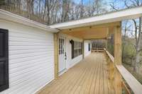 Extra large front deck with a covered center so you can enjoy sitting out in all weather
