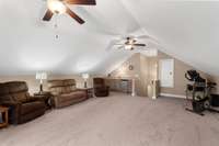 Huge bonus room with wet bar. Attic storage.
