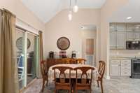 Seating area off the kitchen and door to covered deck.