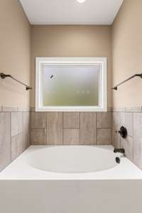 Separate tub in the primary bath.