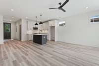 Open concept living room with recessed lighting, modern fixtures & neutral color scheme. 5511 Urbandale Ave Nashville, TN 37209