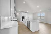 Large kitchen with quartz counter tops and large island!