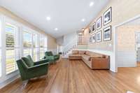 Stairs to bedrooms off den and foyer