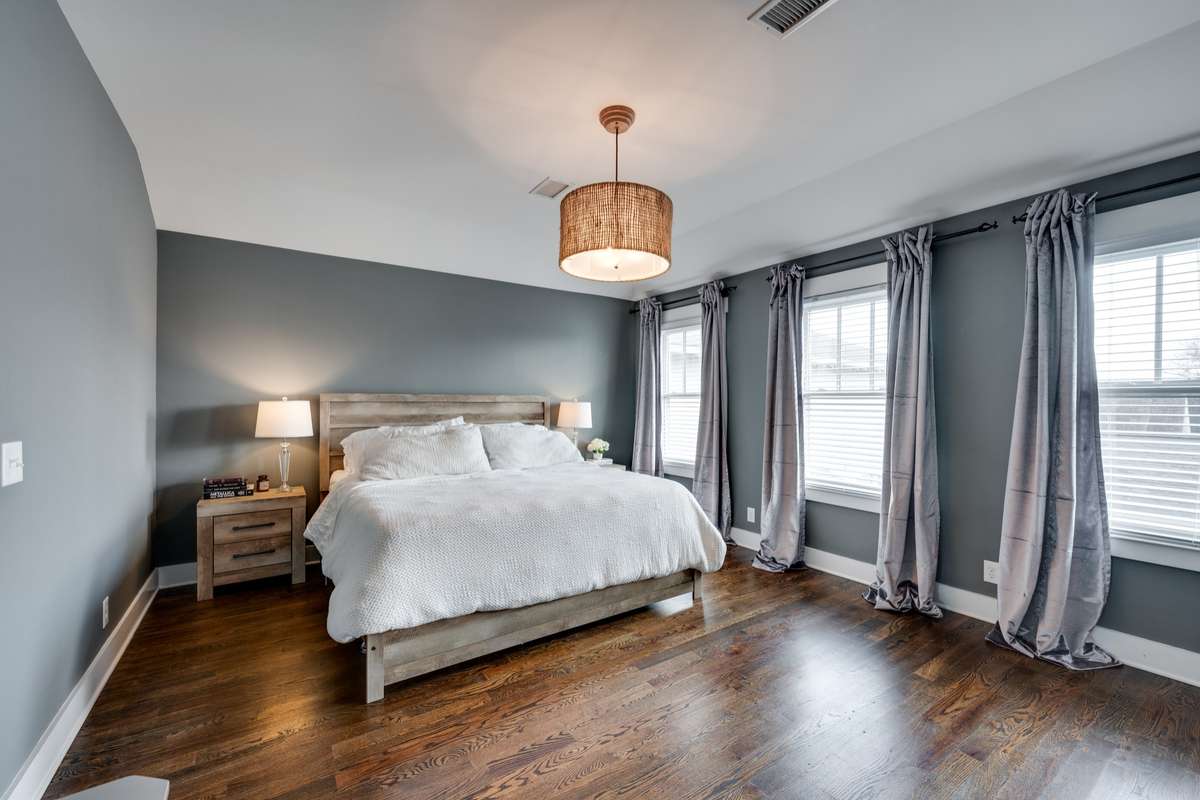Spacious Primary Bedroom with Hardwood Floors.
