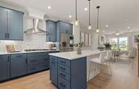 Kitchen is designed with Built-in Stainless-steel Appliances, Quartz Countertops, Direct Vent, & more.

Note: Photo is of a model home in a different community. Specifications & Design May Vary.  See Sales Consultant for more details.