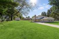 Beautiful yard is partially fenced.