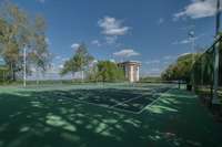 One tennis court with downtown views and one pickleball court