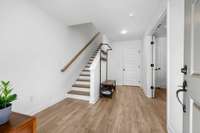 Spacious entry foyer with access to 2-car garage.