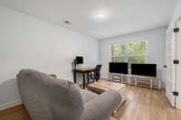 The main level flex room has French doors and half bath.