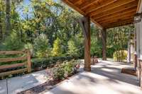 This home's front porch faces mature trees and community green space.