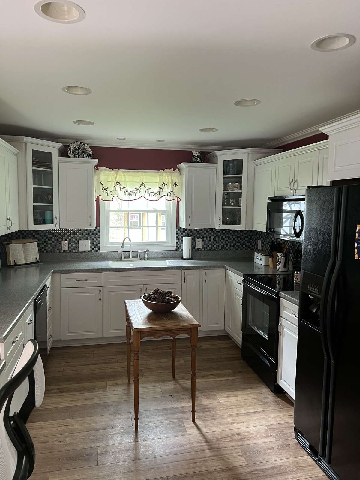 Remodeled kitchen with plenty of cabinets. All appliances remain