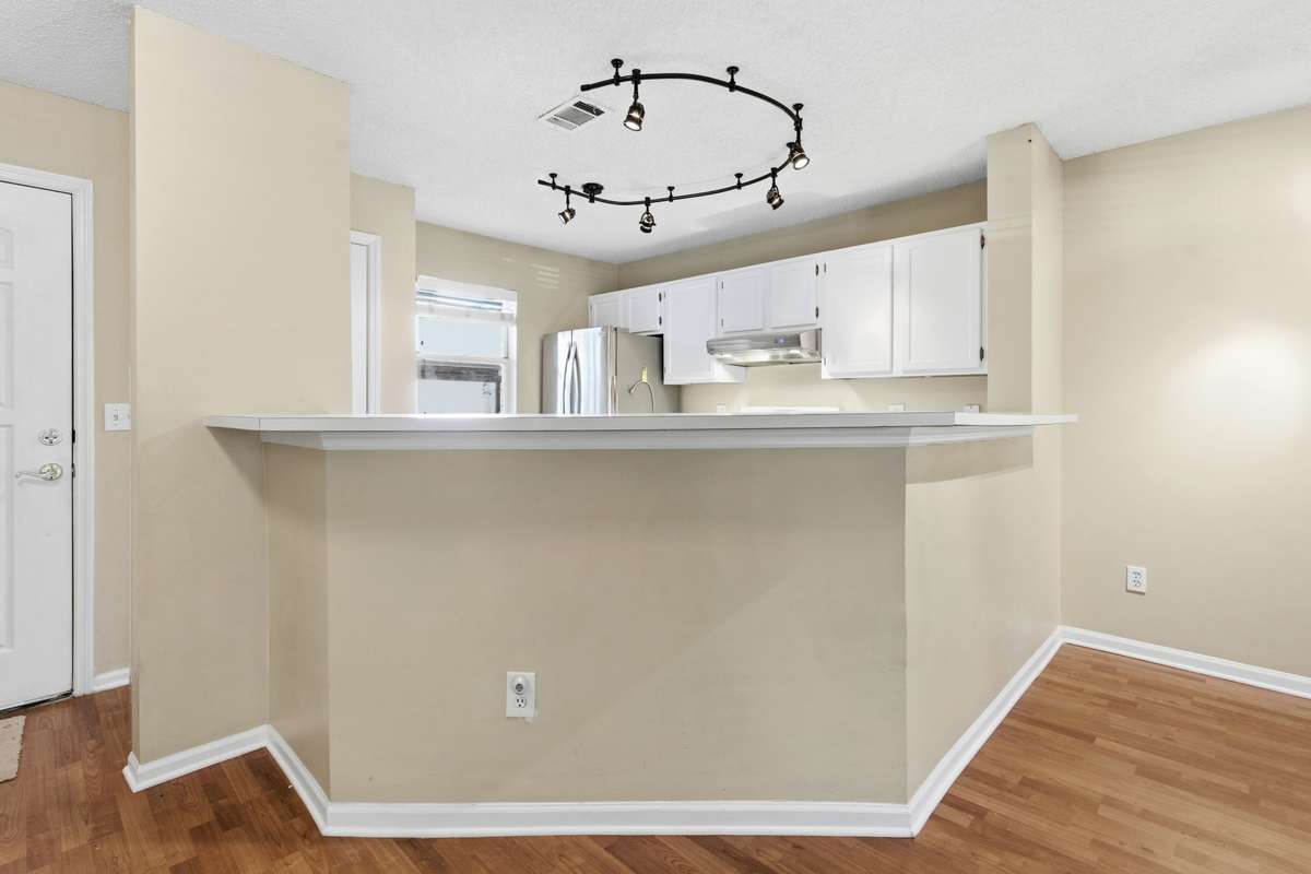 An oversized bar allows for entertaining without giving up living and dining space.
