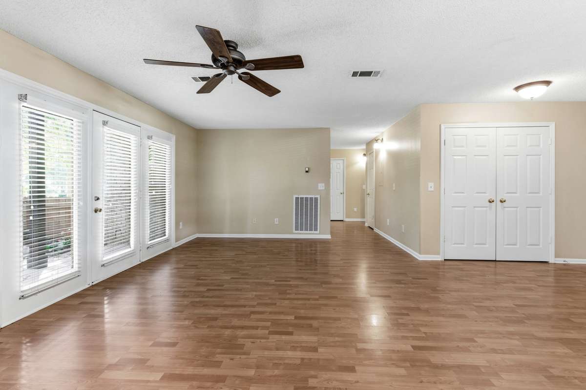 Beautiful windows and French doors give a lot of natural light to the dining and living.