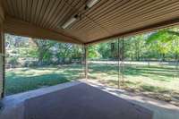 Step outside to your peaceful, lovely backyard space complete with covered patio and fenced in area.