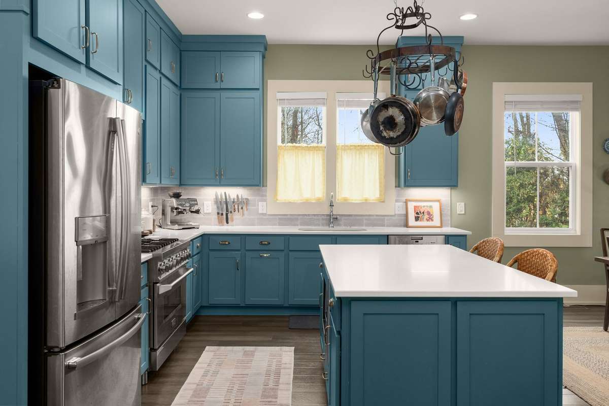 Designed for performance and style, this kitchen pairs sleek stainless appliances with timeless finishes that feel both elevated and practical.