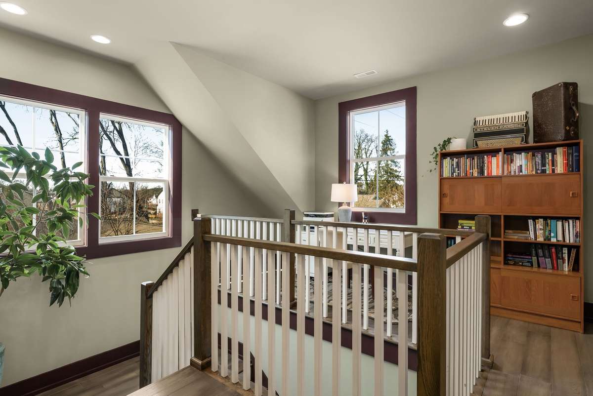 A light-filled upper landing that offers the perfect retreat for quiet work, reading, or reflection—where elevated views and natural light create a calm, inspiring atmosphere.