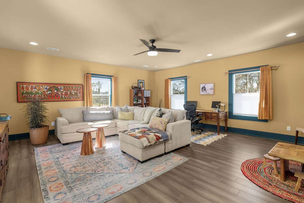 A versatile living space ready for movie nights, playtime, or working from home—bright, flexible, and designed to adapt as life evolves.