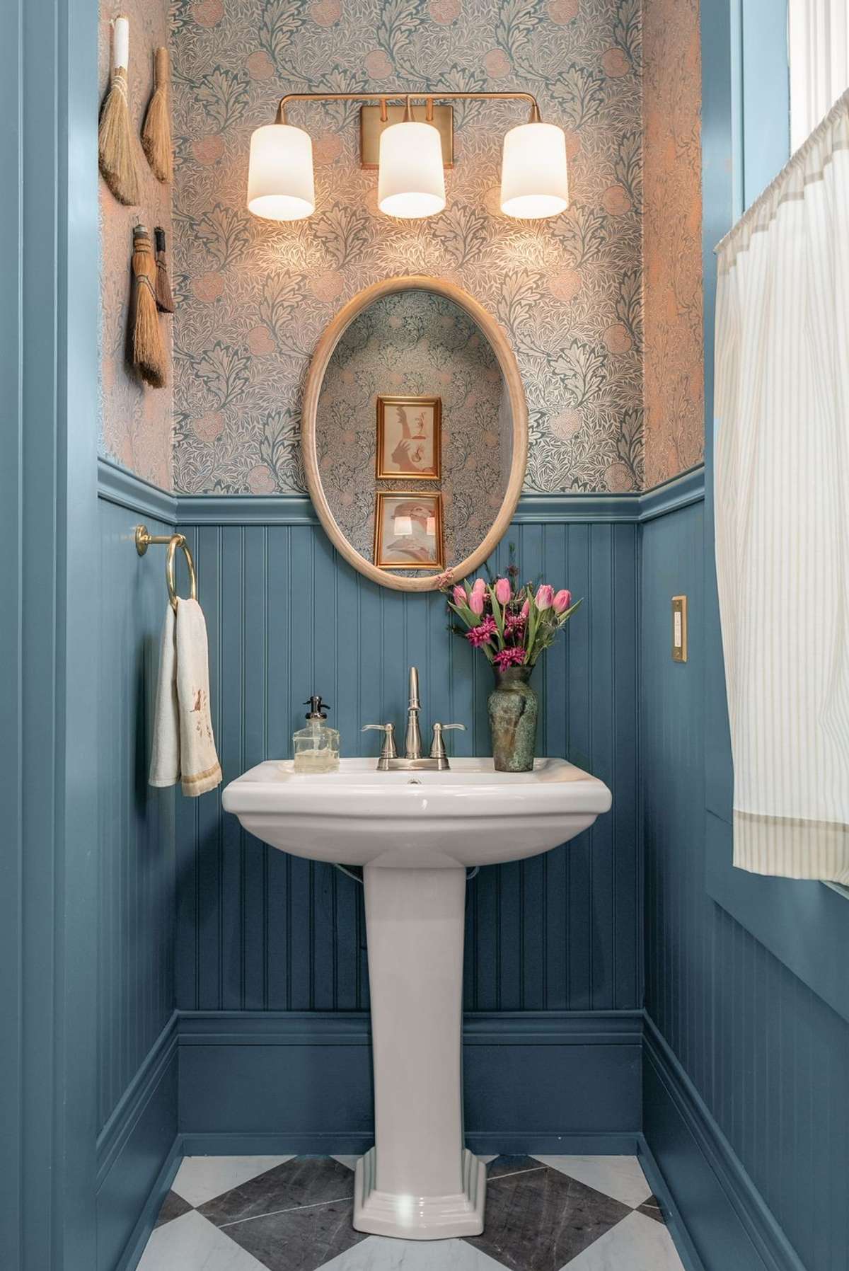 A thoughtfully designed powder room where layered textures, classic finishes, and curated details elevate even the smallest spaces into something memorable.