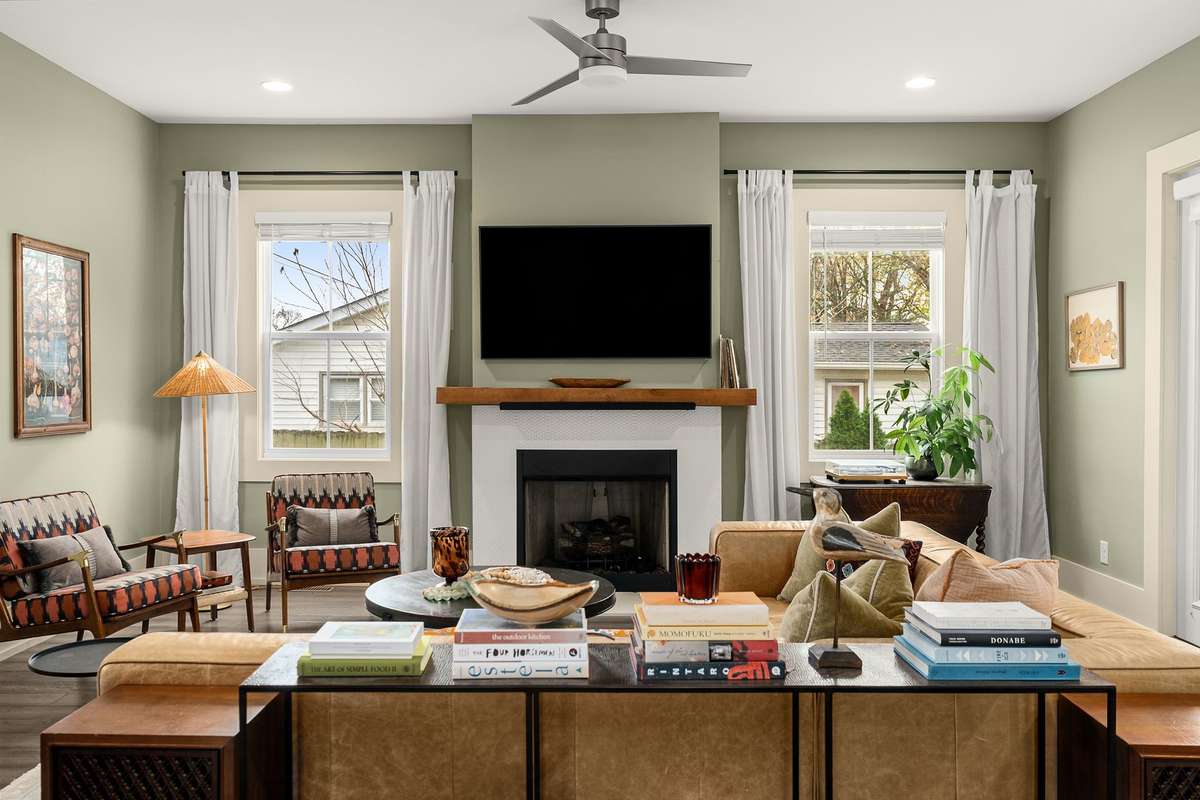Centered around the fireplace, this living room becomes a warm retreat—perfect for cozy evenings, calm weekends, and meaningful moments.