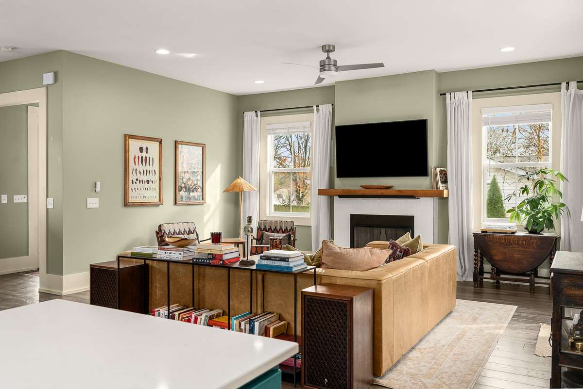 A living space designed for both quiet mornings and effortless entertaining—filled with natural light and finished with warm textures that make it instantly inviting.
