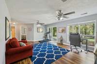 Downstairs family room with lake view and sliding glass door