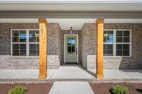 Covered front porch and lots of windows for tons of natural light.