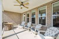 During your viewing of this home, the homeowner invites you to sit for a moment to truly enjoy the peaceful ambiance of the private back porch, where stunning views and the soothing sounds of nature create the perfect retreat.