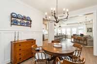 This dining area strikes the perfect balance between openness and definition. While it flows seamlessly into the kitchen and living space, its distinct placement allows for easy decorating and furniture arrangement.