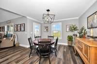 Dining Room- 2"blinds, LVP flooring, crown molding