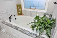 Primary Bedroom- ensuite bath- Tile flooring, double vanities, separate tub & shower, whirlpool