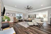 LVP flooring, crown molding, recessed lighting, ceiling fan, 10' ceiling