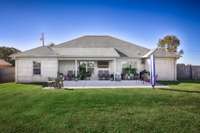 Back of house- Nice, level yard, privacy fence, open patio, cover patio with home entry