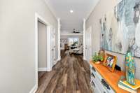 Foyer- LVP flooring, crown molding, recessed lighting