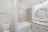 third full bath, located upstairs off hallway near bedroom #4.