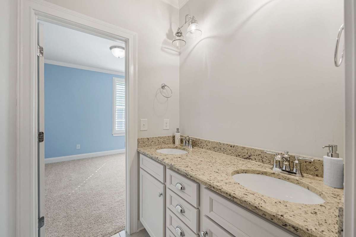 shared bath with dual vanities between bedroom #2 and #3.